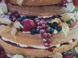 Rustic naked sponge wedding cake, fresh fruits & Chantilly cream on a beautiful piece of&nbsp;eucalyptus.