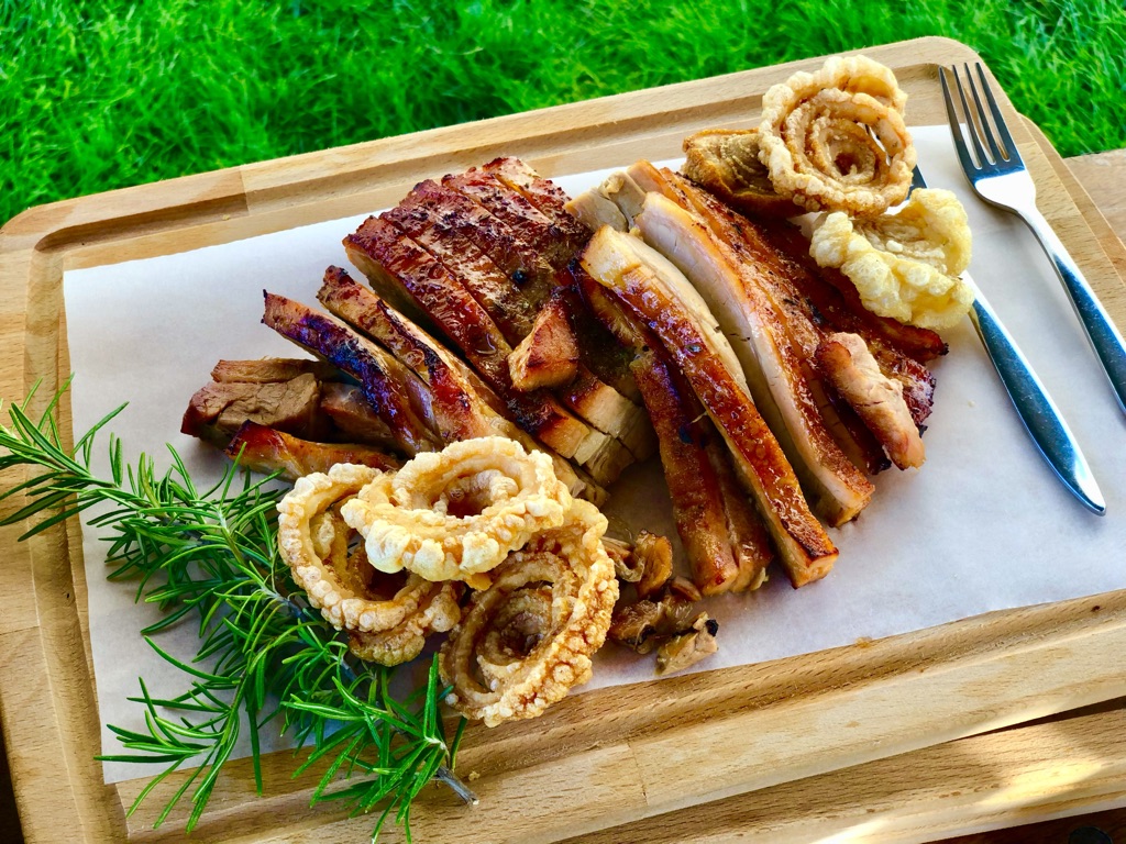 private chef experience serving luxurious roast pork with crackling